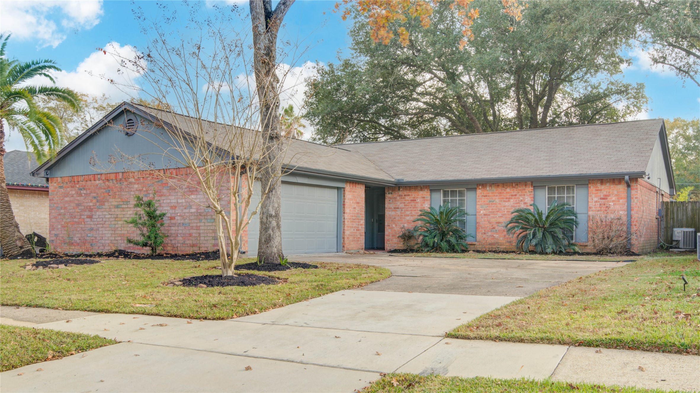 6722 Lynngate Drive Spring, TX 77373 - Photo 1 of 31 a front view of a house with a yard and garage