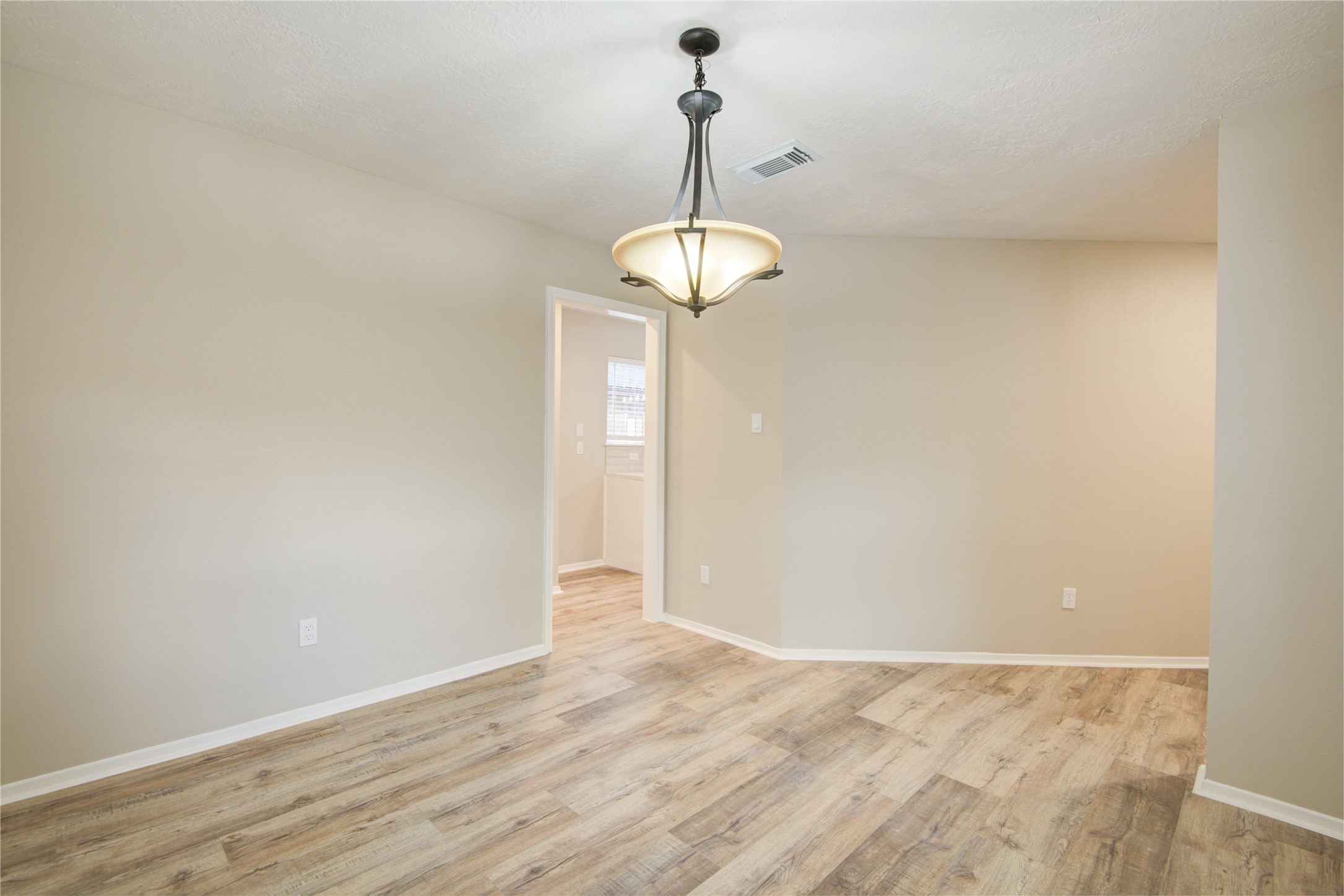 6722 Lynngate Drive Spring, TX 77373 - Photo 12 of 31 a view of empty room with wooden floor