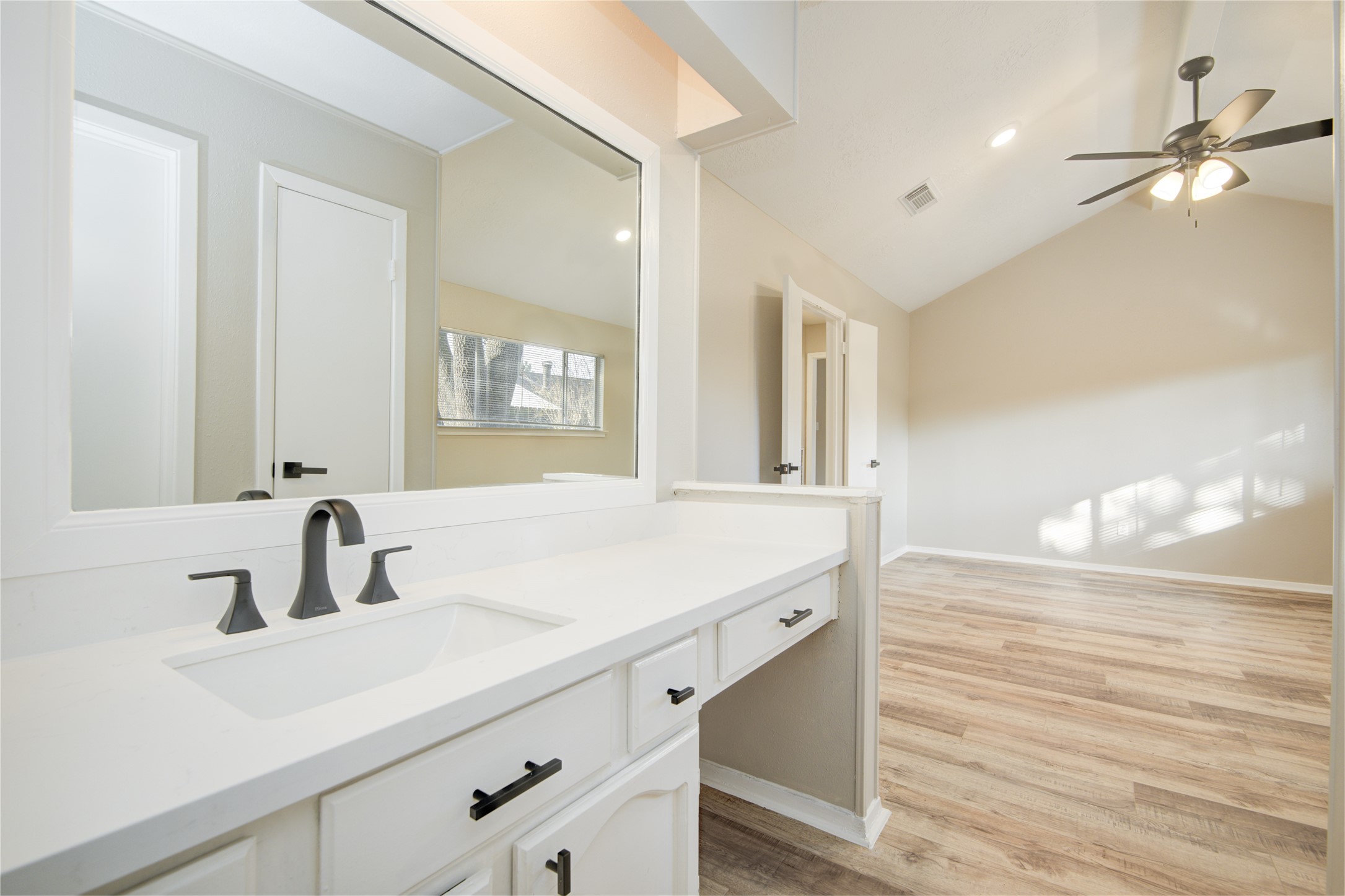 6722 Lynngate Drive Spring, TX 77373 - Photo 20 of 31 a bathroom with a sink double vanity and a mirror
