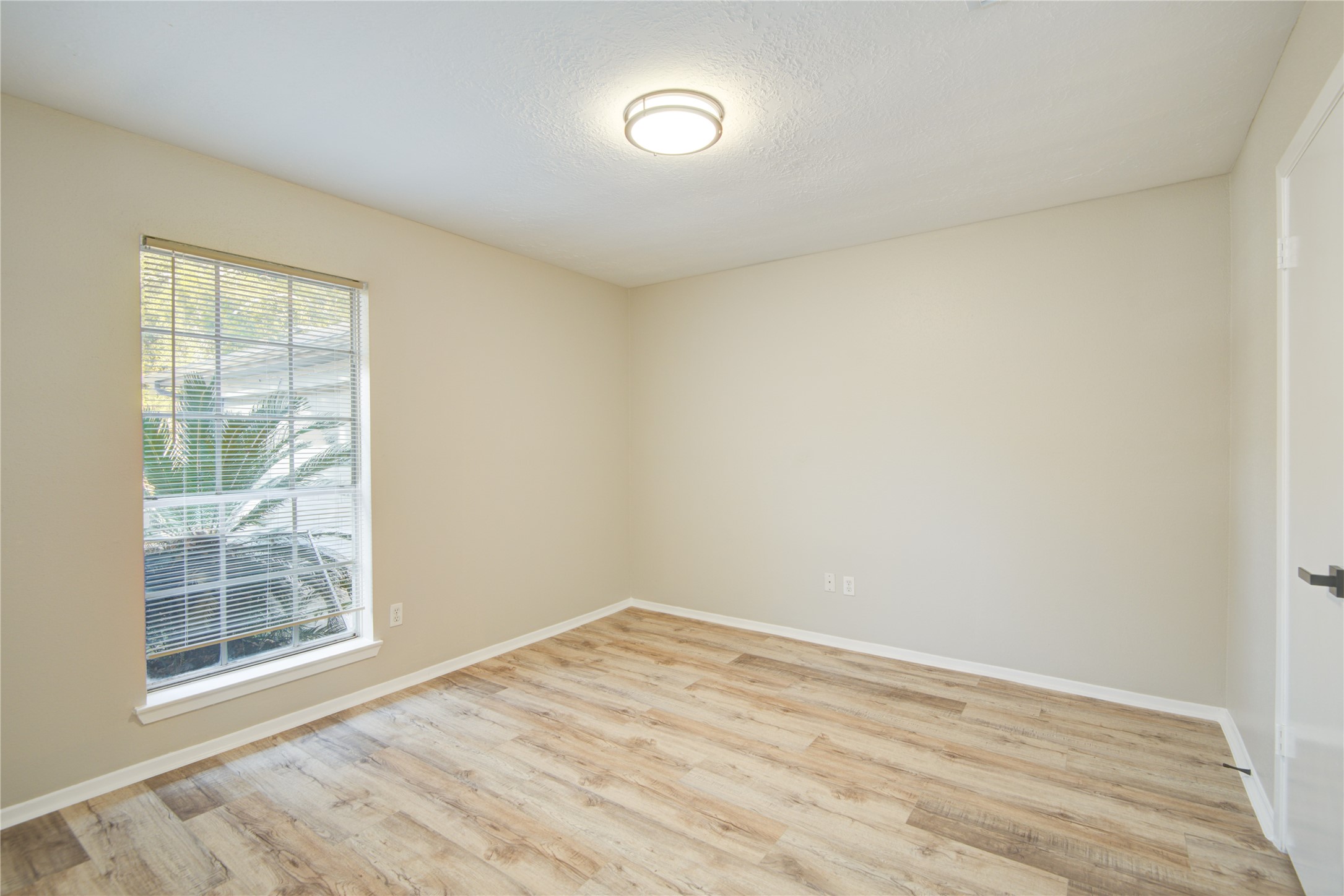 6722 Lynngate Drive Spring, TX 77373 - Photo 27 of 31 a view of empty room with wooden floor and fan