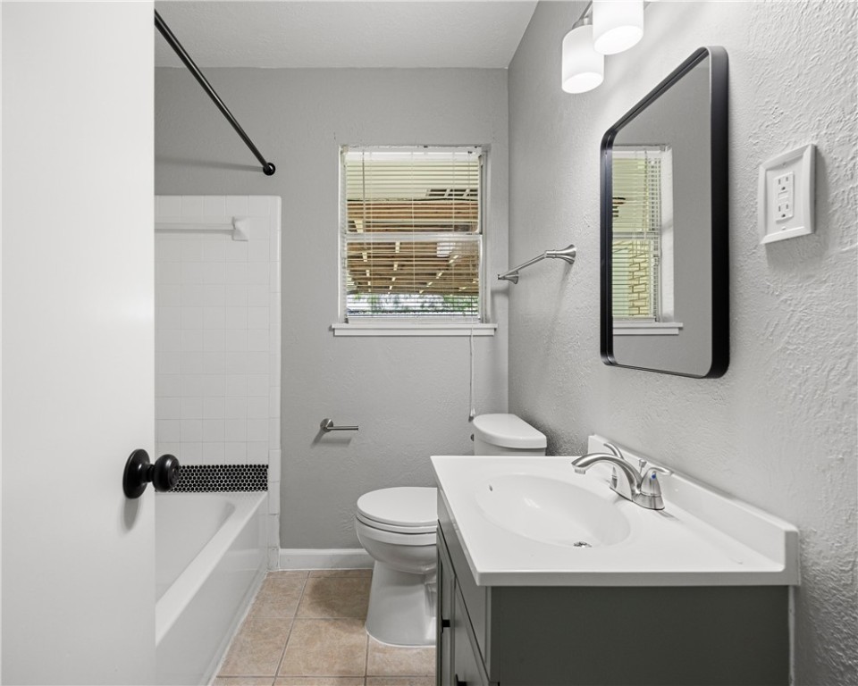 4014 Bray Drive Corpus Christi, TX 78413 - Photo 11 of 20 a bathroom with a sink toilet and mirror