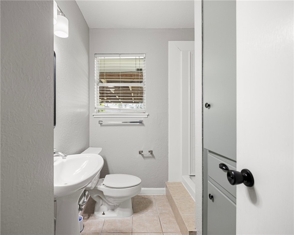 4014 Bray Drive Corpus Christi, TX 78413 - Photo 12 of 20 a white toilet sitting next to a bathroom sink