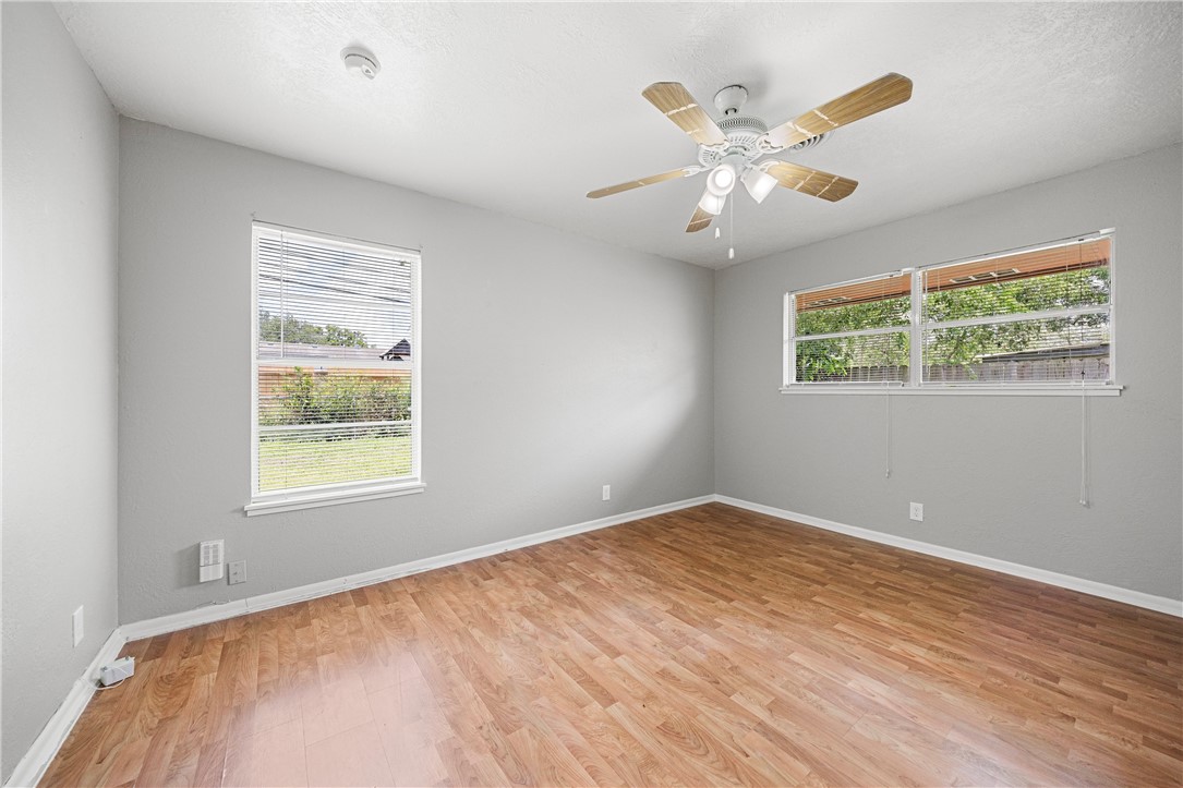 4014 Bray Drive Corpus Christi, TX 78413 - Photo 16 of 20 a view of an empty room with wooden floor and a window