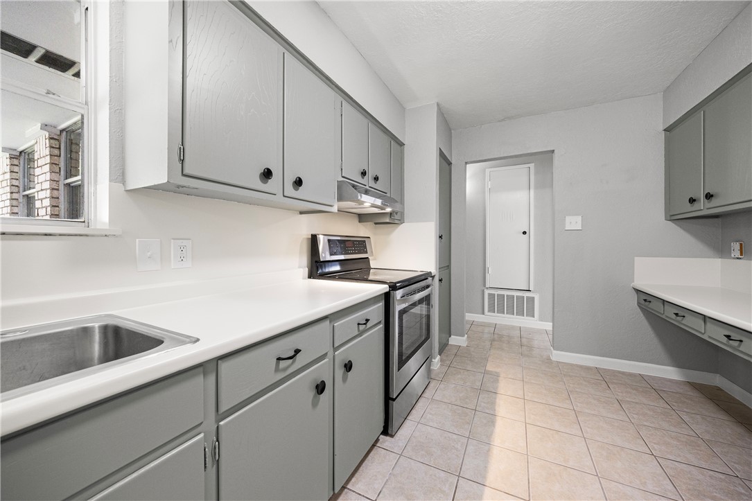 4014 Bray Drive Corpus Christi, TX 78413 - Photo 6 of 20 a kitchen with granite countertop a sink and cabinets