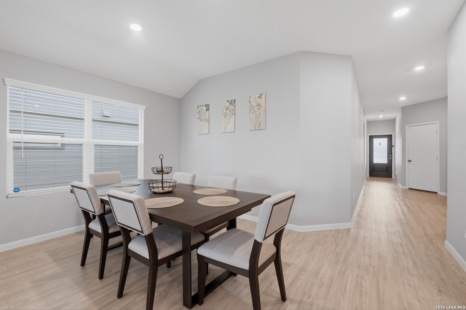 31589 Untrodden Way Bulverde, TX 78163 - Photo 14 of 26 a view of a dining room with furniture and wooden floor