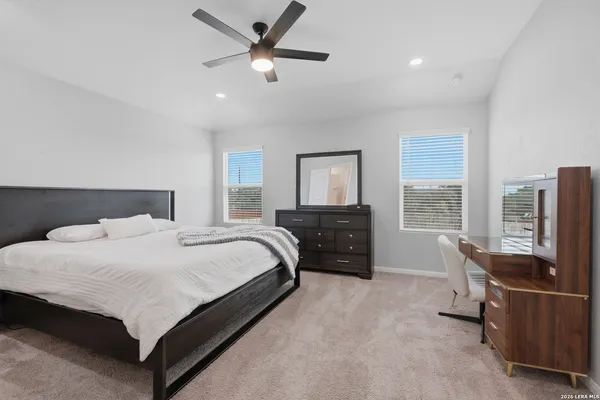 a bedroom with a bed and a dresser