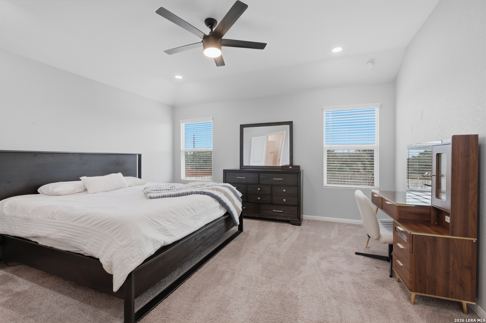 31589 Untrodden Way Bulverde, TX 78163 - Photo 15 of 26 a spacious bedroom with a bed and window