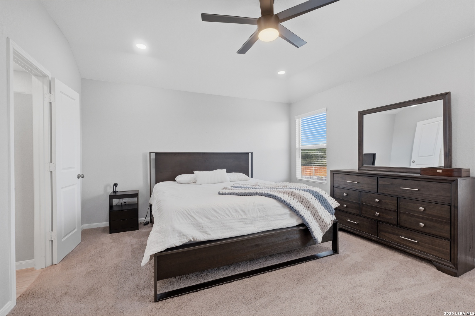 31589 Untrodden Way Bulverde, TX 78163 - Photo 16 of 26 a bedroom with a bed and a dresser