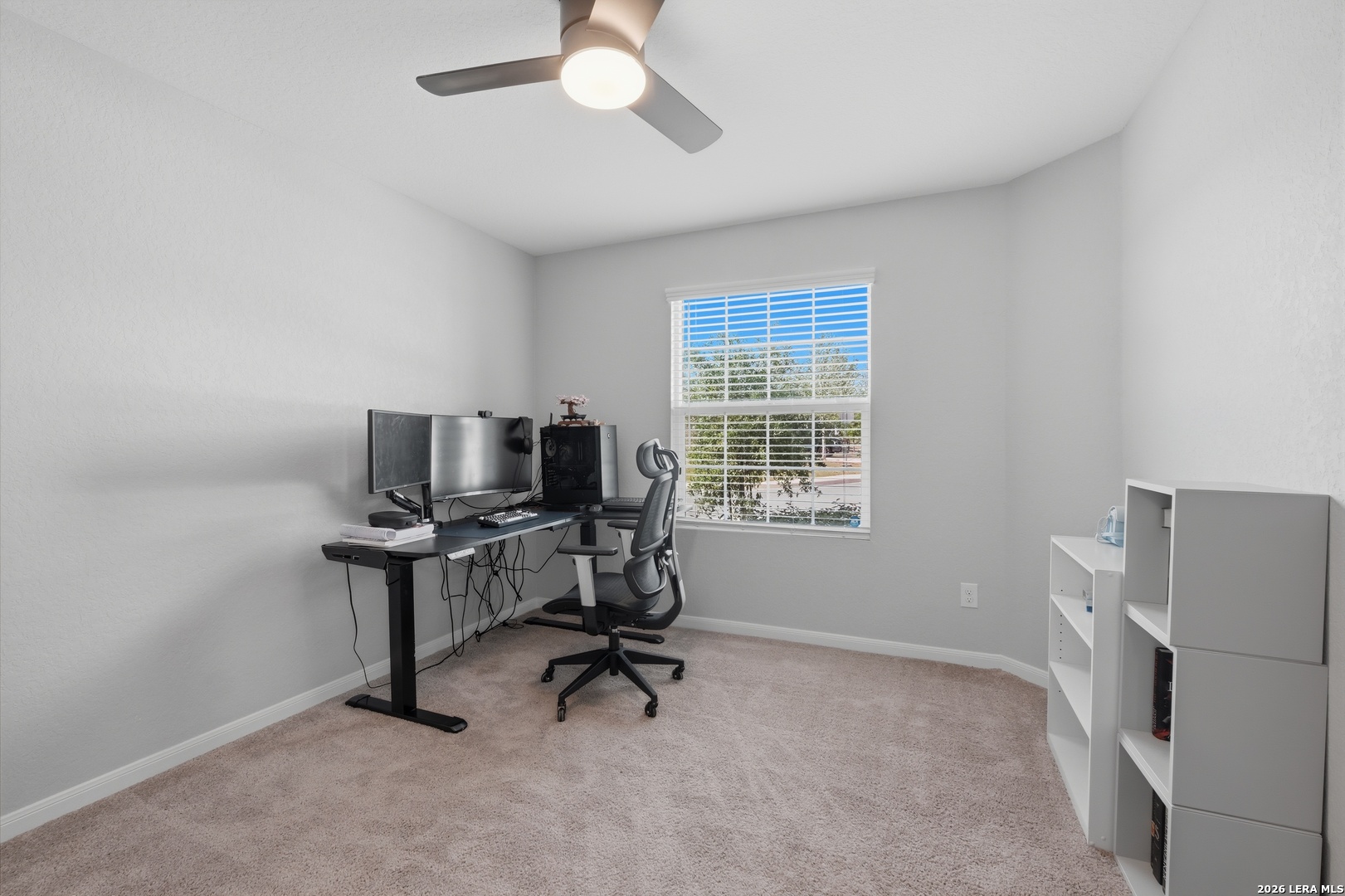 31589 Untrodden Way Bulverde, TX 78163 - Photo 19 of 26 a view of a workspace with furniture and a window