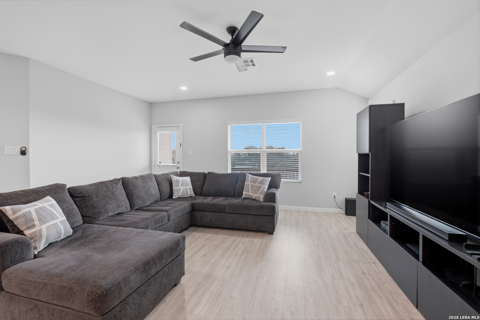 31589 Untrodden Way Bulverde, TX 78163 - Photo 5 of 26 a living room with furniture and a flat screen tv