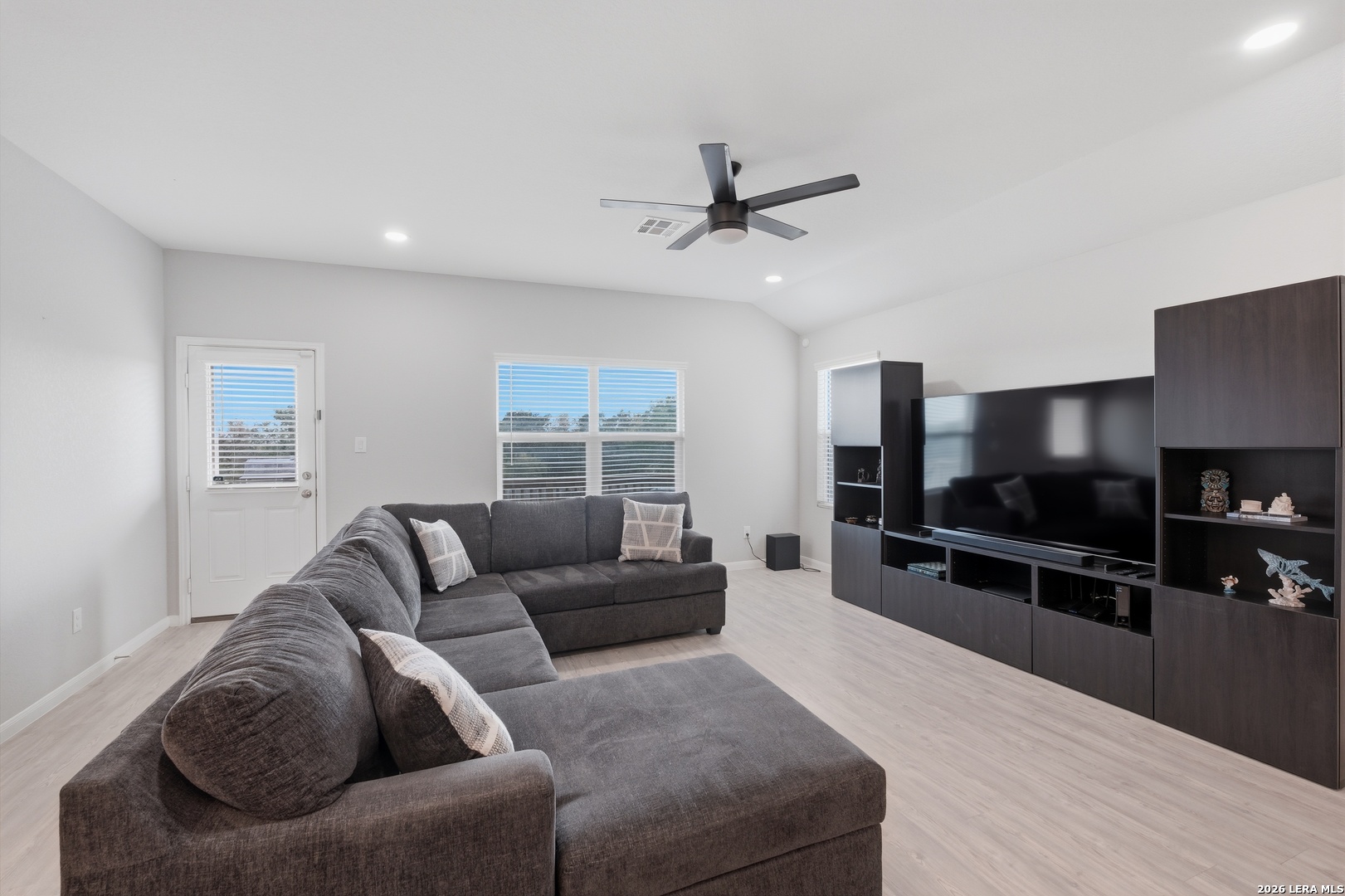 31589 Untrodden Way Bulverde, TX 78163 - Photo 6 of 26 a living room with furniture and a flat screen tv