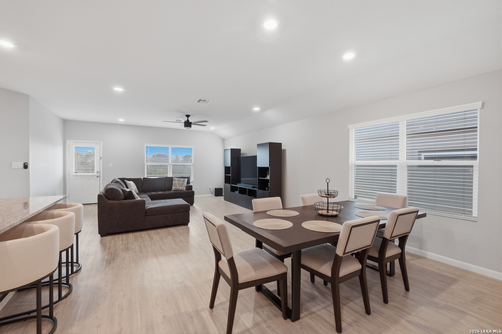 31589 Untrodden Way Bulverde, TX 78163 - Photo 9 of 26 a view of a dining room with furniture and wooden floor