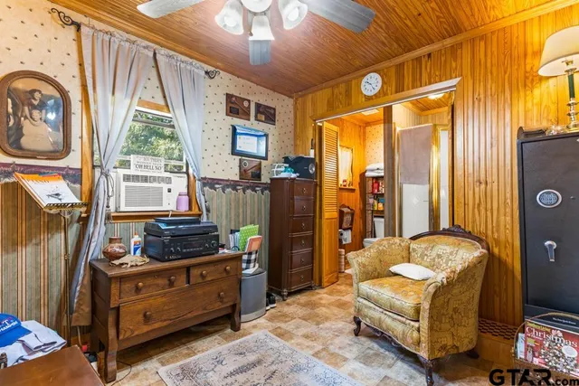 a bedroom with furniture and a window