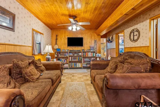 a living room with furniture and a flat screen tv