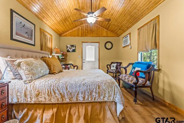 a bathroom with a toilet a sink and a mirror