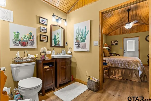 a view of walk in closet with clothes