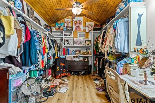 a front view of a house with garden and sitting area