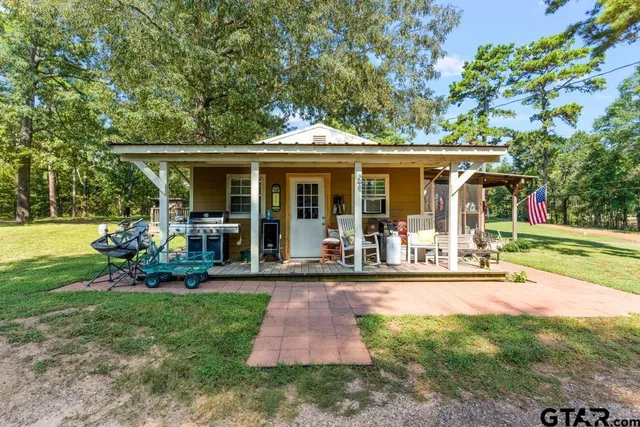 a view of a deck and a backyard