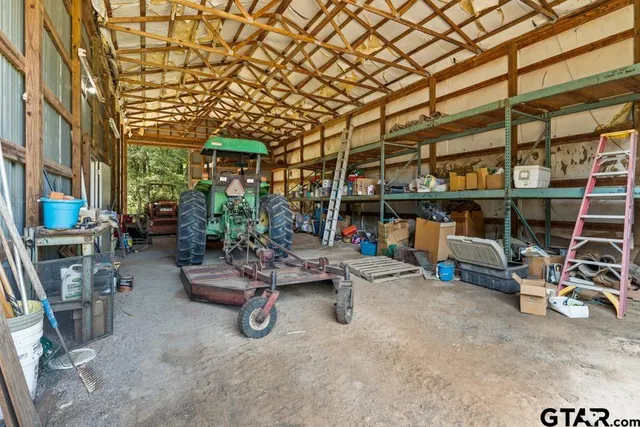 a view of a patio with table and chairs