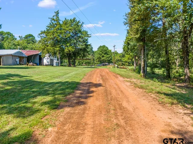 a view of outdoor space with deck and yard
