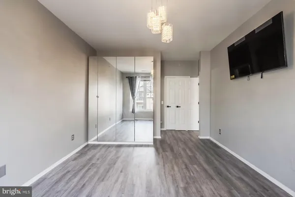 a view of an entryway with wooden floor