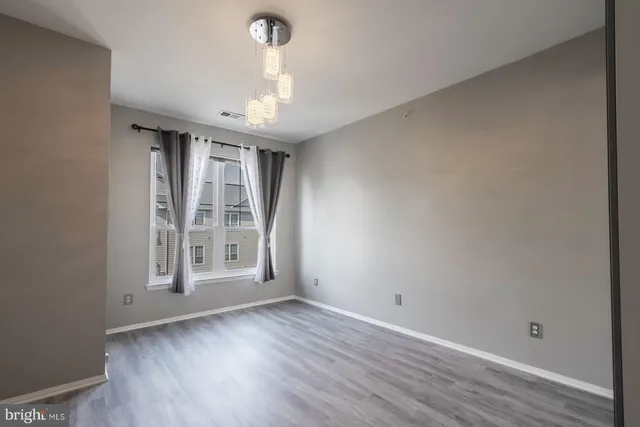 a view of a livingroom with wooden floor