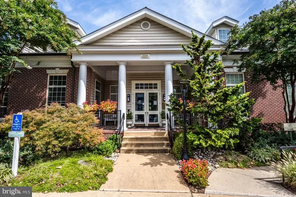 a backyard of a house with sitting area and furniture