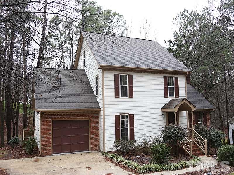 11957 Eagle Cliff Court Raleigh, NC 27613 - Photo 2 of 25 a front view of house with yard and trees around