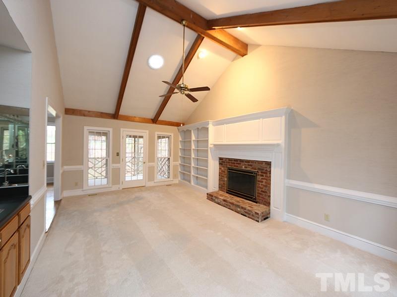 11957 Eagle Cliff Court Raleigh, NC 27613 - Photo 14 of 25 a view of an empty room with window and fire place