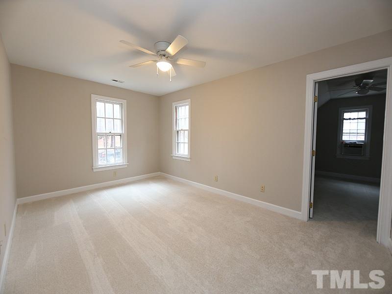 11957 Eagle Cliff Court Raleigh, NC 27613 - Photo 18 of 25 a view of an empty room with a window