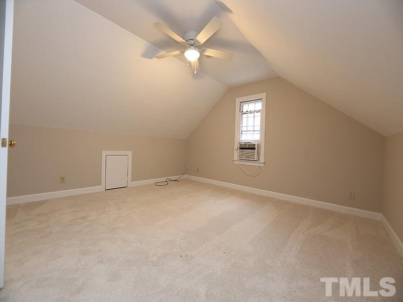 11957 Eagle Cliff Court Raleigh, NC 27613 - Photo 19 of 25 an empty room with a window and a fan