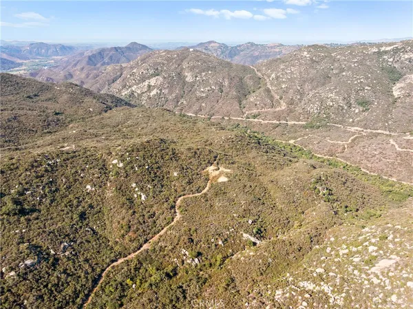 a view of a mountain range in a cloudy sky
