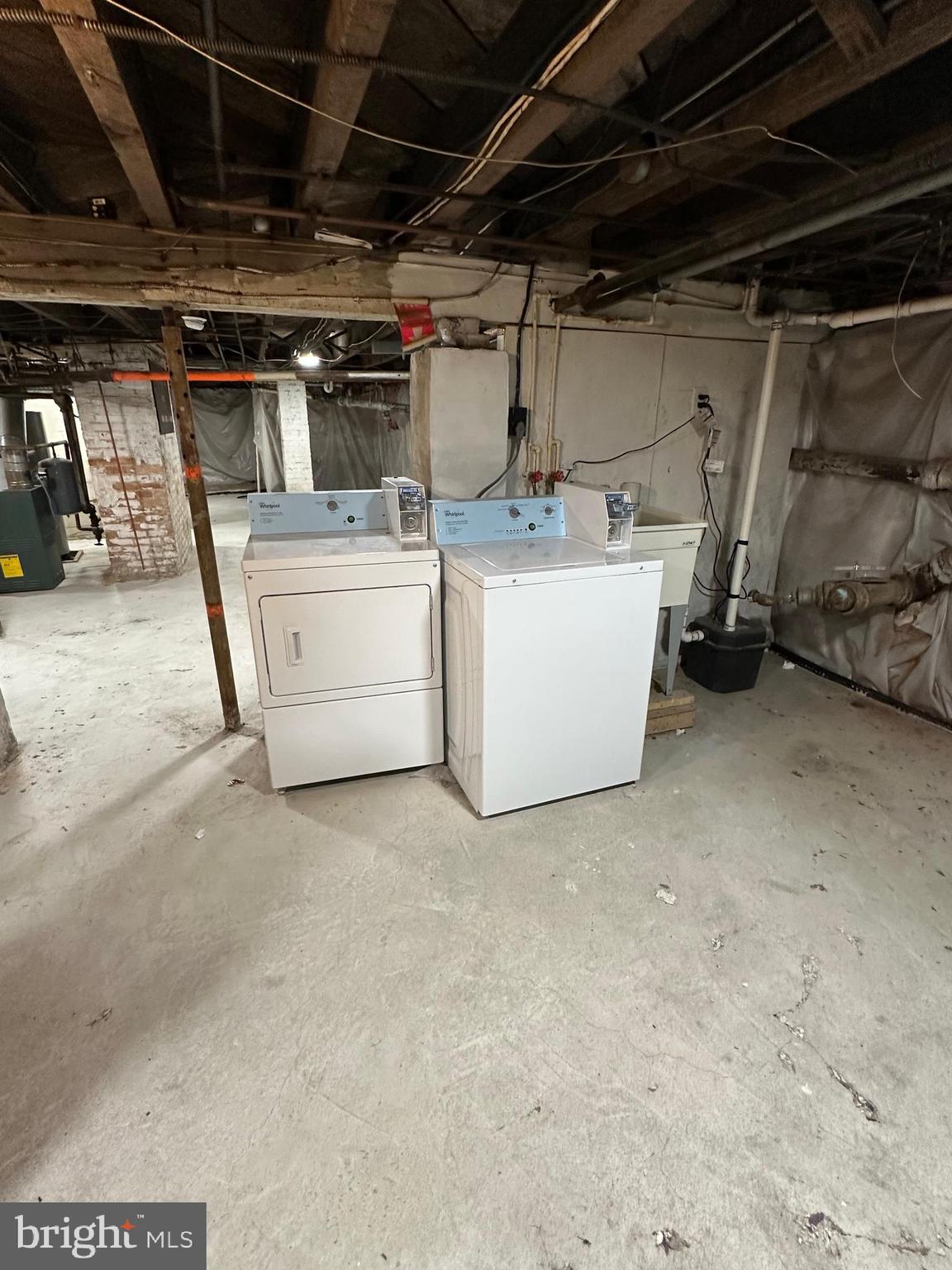 4606 Ridge Avenue Halethorpe, MD 21227 - Photo 11 of 11 a utility room with dryer and washer
