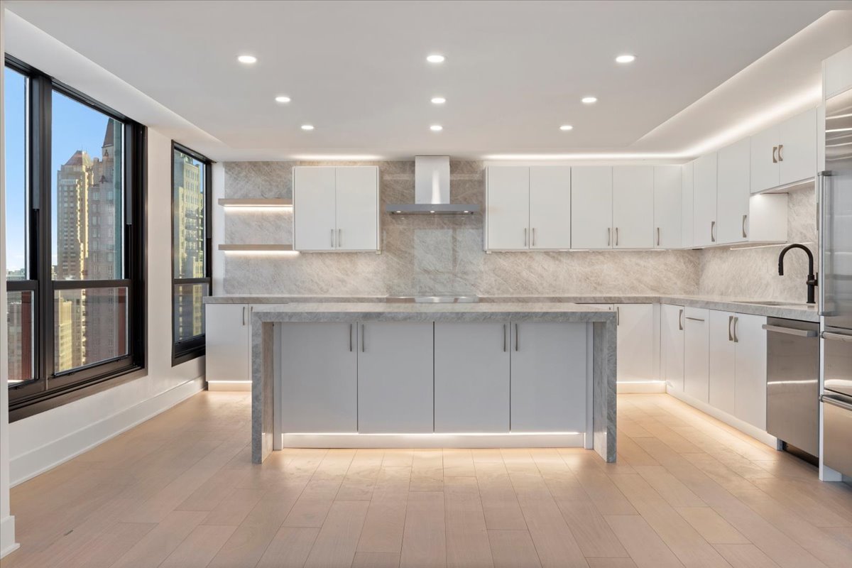1030 North State Street, Unit 52EFG Chicago, IL 60610 - Photo 9 of 32 a view of kitchen with stainless steel appliances granite countertop a stove a sink and a refrigerator