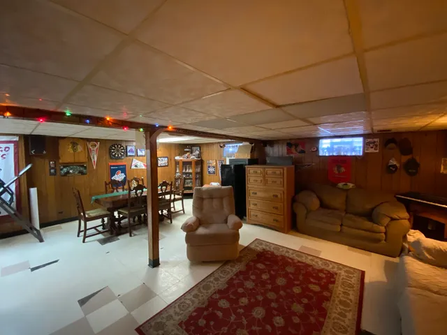 a living room with lots of furniture and gym equipment