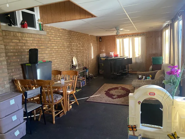 a dinning table and chairs in a room