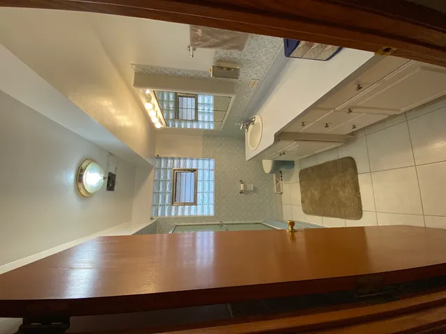 a view of room with window and wooden floor