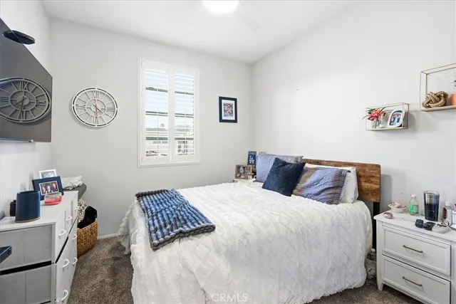 a bathroom with a sink vanity mirror and toilet