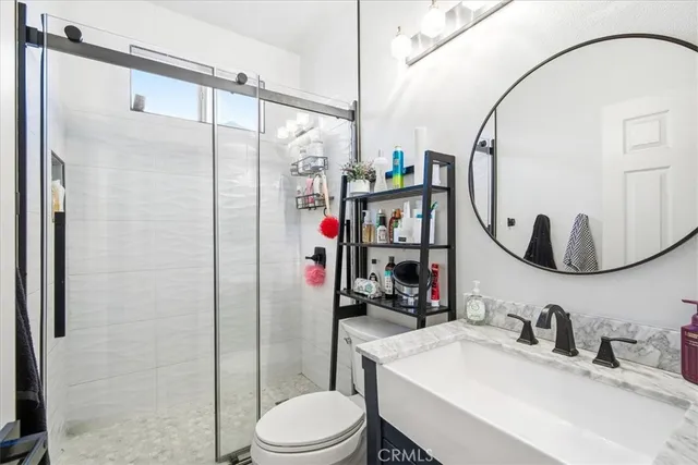 a bedroom with a large bed and a dresser