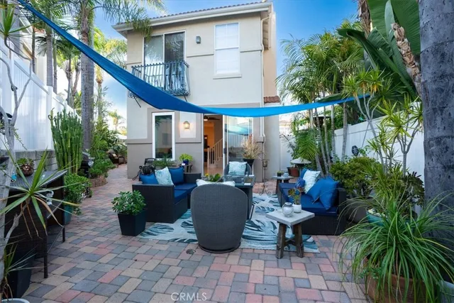 a view of a backyard with sitting area
