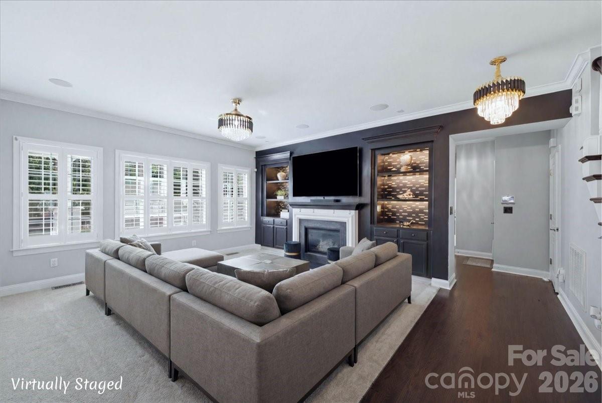 1825 Laveta Road Charlotte, NC 28269 - Photo 11 of 48 a living room with furniture and a flat screen tv
