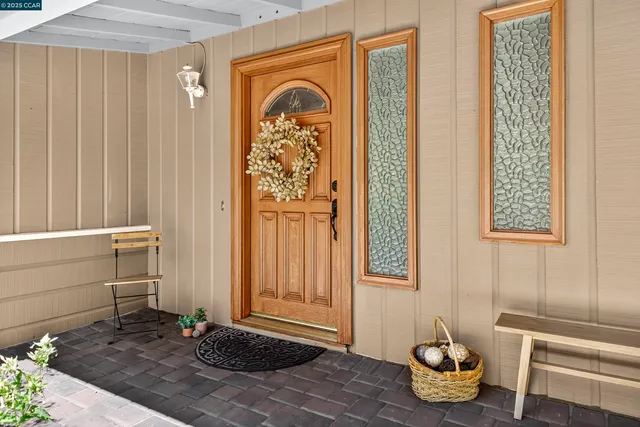 a view of porch with a table and chair
