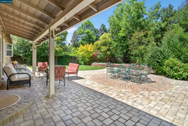 a outdoor space with lots of white furniture