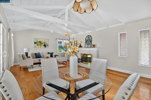 a living room with fireplace furniture and a window