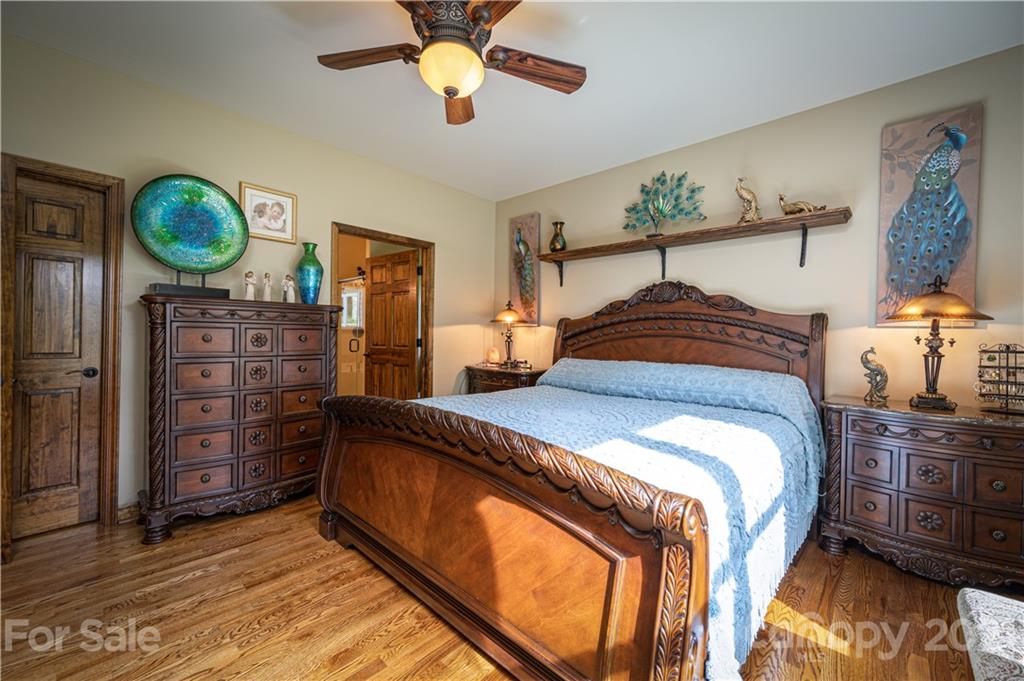 4773 Grigg Road Lincolnton, NC 28092 - Photo 11 of 34 a bedroom with a bed and wooden floor