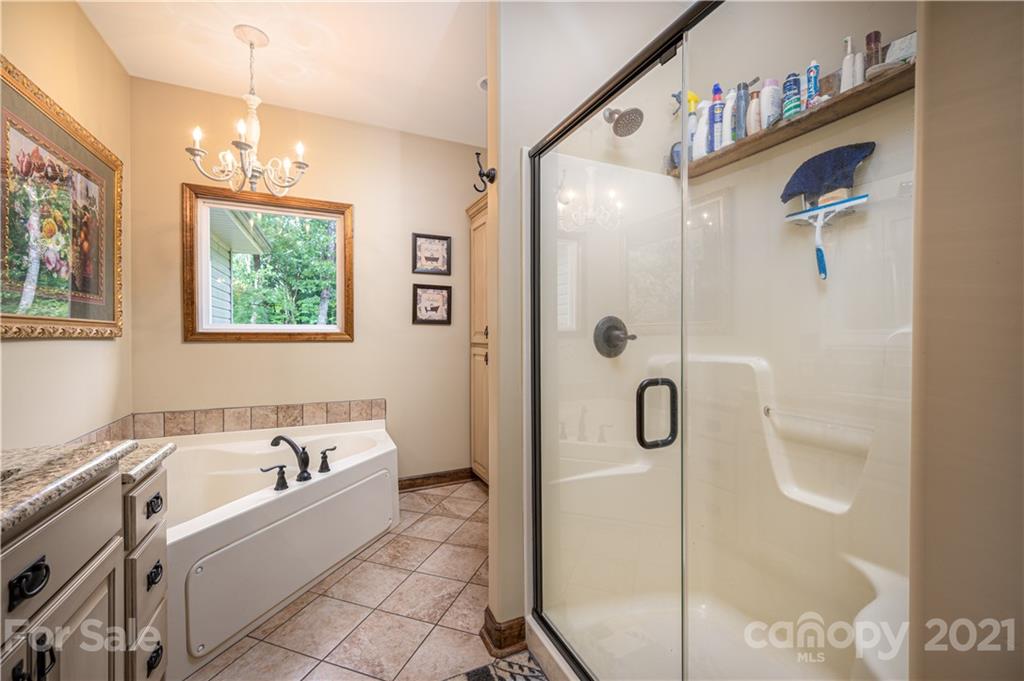 4773 Grigg Road Lincolnton, NC 28092 - Photo 13 of 34 a bathroom with a tub sink and mirror
