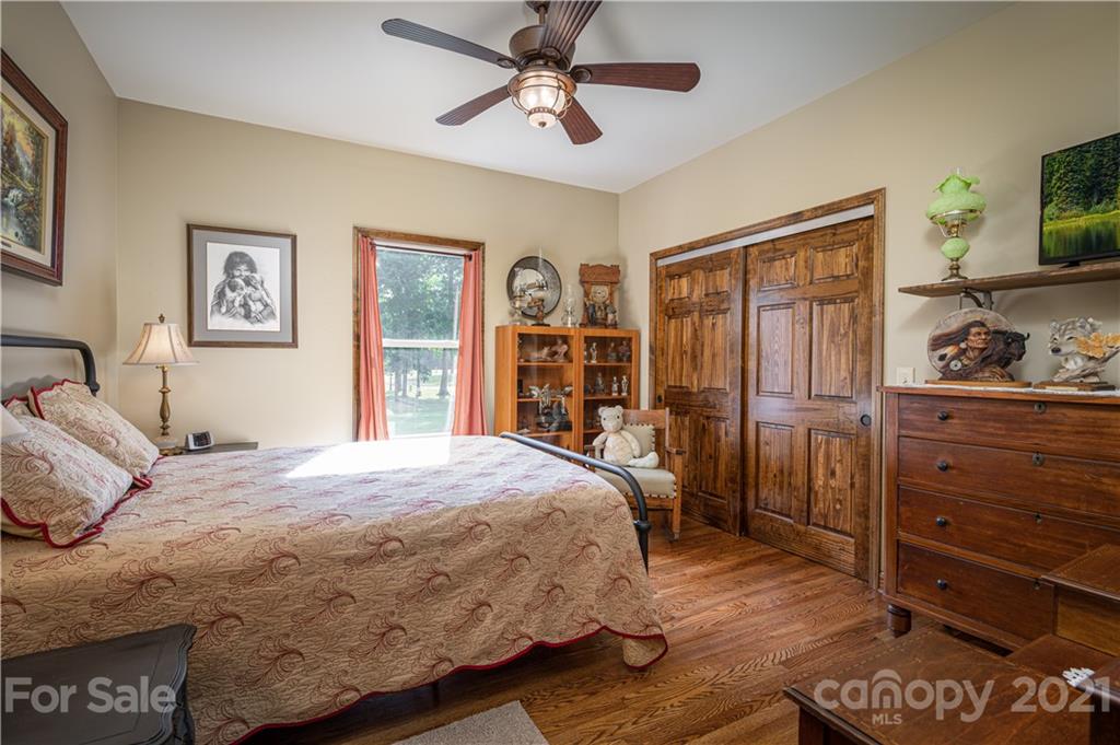 4773 Grigg Road Lincolnton, NC 28092 - Photo 15 of 34 a bedroom with a bed and wooden floor