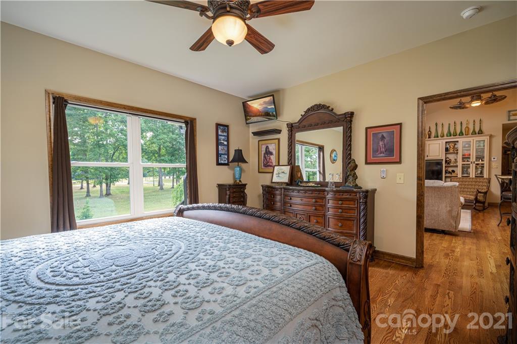 4773 Grigg Road Lincolnton, NC 28092 - Photo 16 of 34 a bedroom with a bed and large window