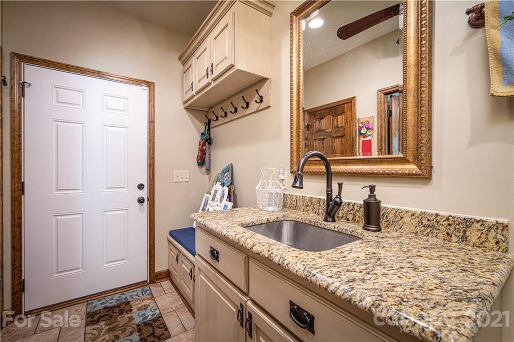 4773 Grigg Road Lincolnton, NC 28092 - Photo 20 of 34 a kitchen with a sink and cabinets