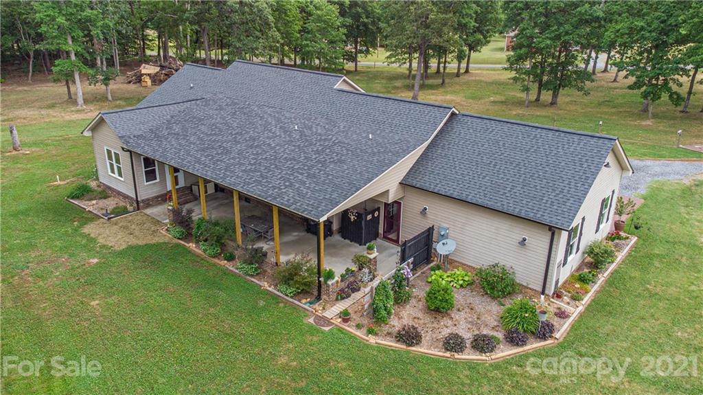 4773 Grigg Road Lincolnton, NC 28092 - Photo 26 of 34 an aerial view of residential house with outdoor space and trees around